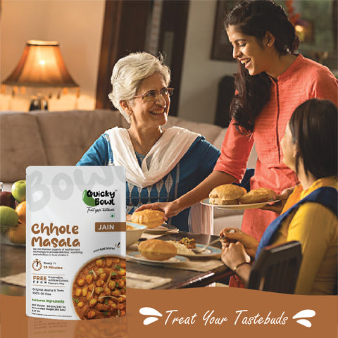 A family enjoying chhole masala and puri for dinner A family enjoying chhole masala and puri for dinner